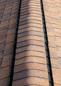 inspecting attic ventilation during roof inspection in New Bedford