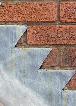 checking flashing integrity during roof inspection in New Bedford
